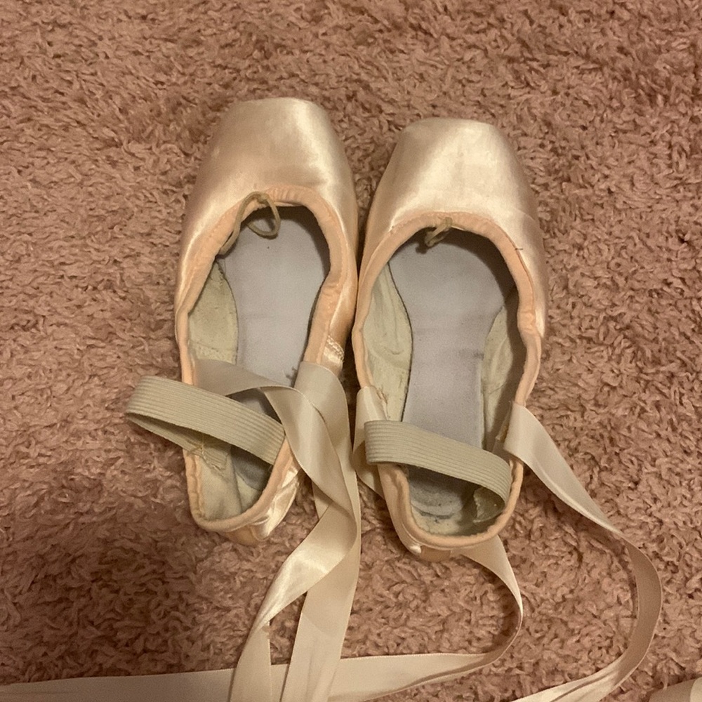 Two pairs of used pointe shoes